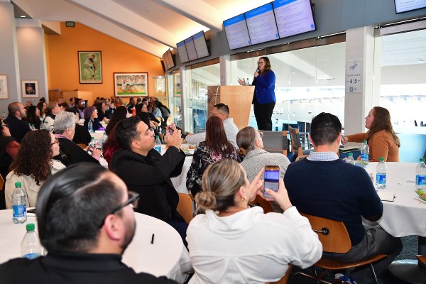 Kerry Kilma presenting to audience in the Dodger Stadium Club